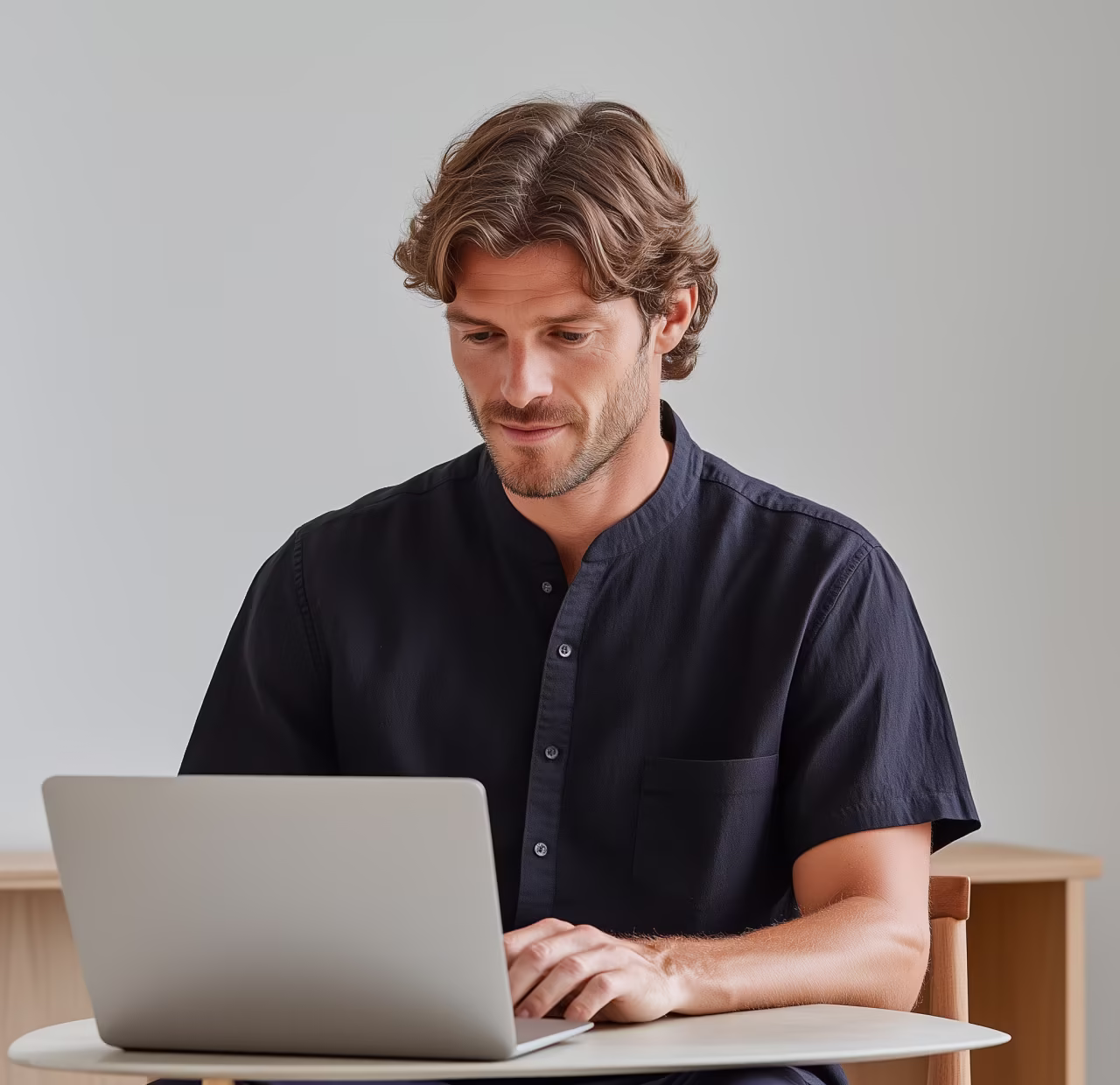 Consultant working on a laptop, developing business strategy